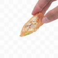 Hand holding a half-eaten lumpia with visible filling on a white background