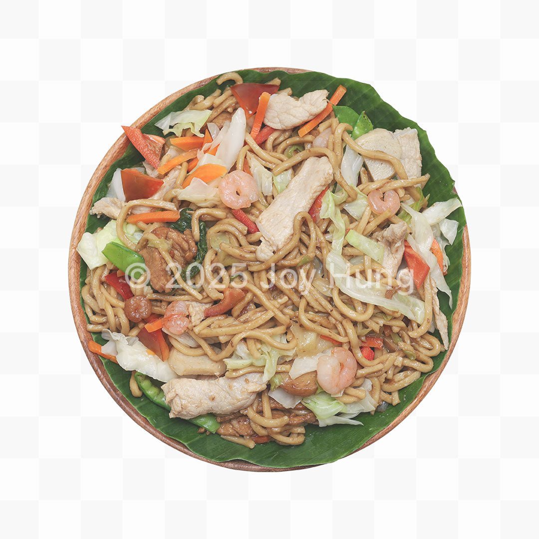 Plated dish of noodles with vegetables on a white background