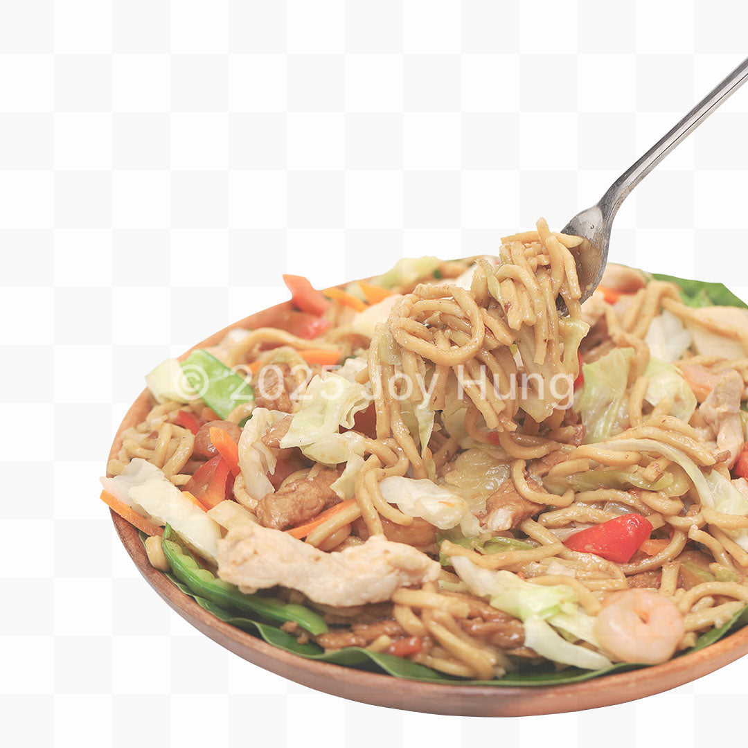 Noodle dish with vegetables on a white background