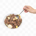 Hand holding a spoon over a bowl of food on a white background