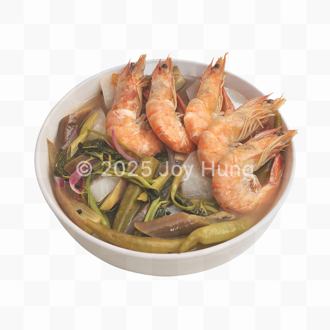 Bowl of sinigang soup shrimp and vegetables on a white background
